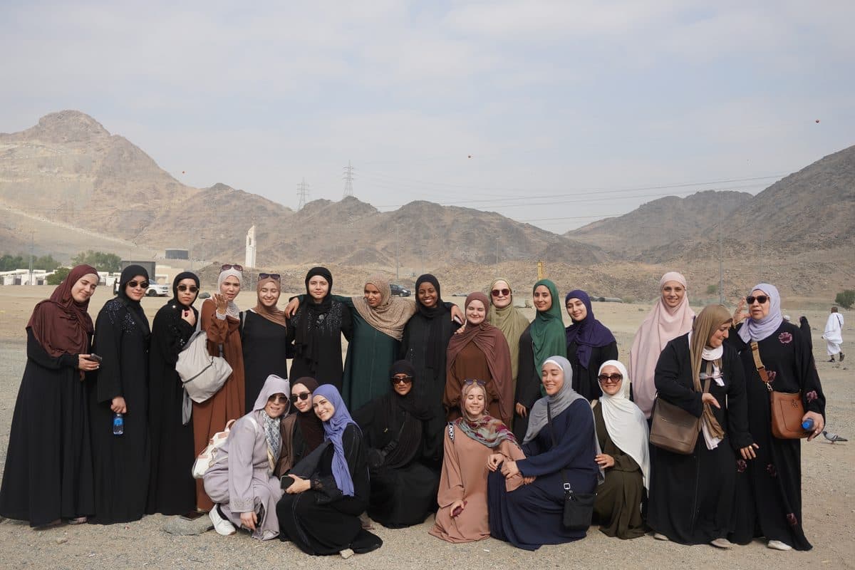 The whole group photographed together in the hills outside Madinah